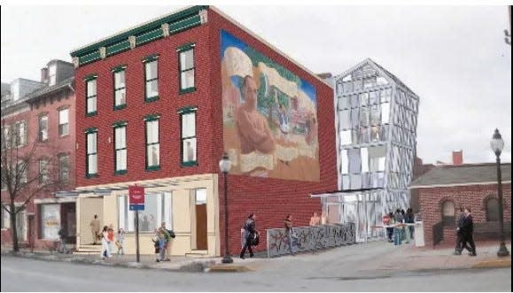 A decade-old rendering showing the former Fraternal Order of Eagles lodge on its way to becoming MarketView Arts. The York Barbell mural, one of 18 outdoor panels that were part of the turn-of-the-21st-century Murals of York program, appears on the building’s side. It’s still there today.