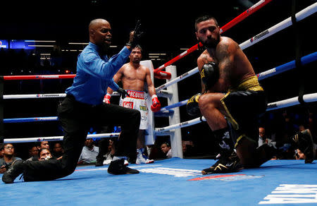 Boxing - WBA Welterweight Title Fight - Manny Pacquiao v Lucas Matthysse - Axiata Arena, Kuala Lumpur, Malaysia - July 15, 2018 Manny Pacquiao in action against Lucas Matthysse REUTERS/Lai Seng Sin