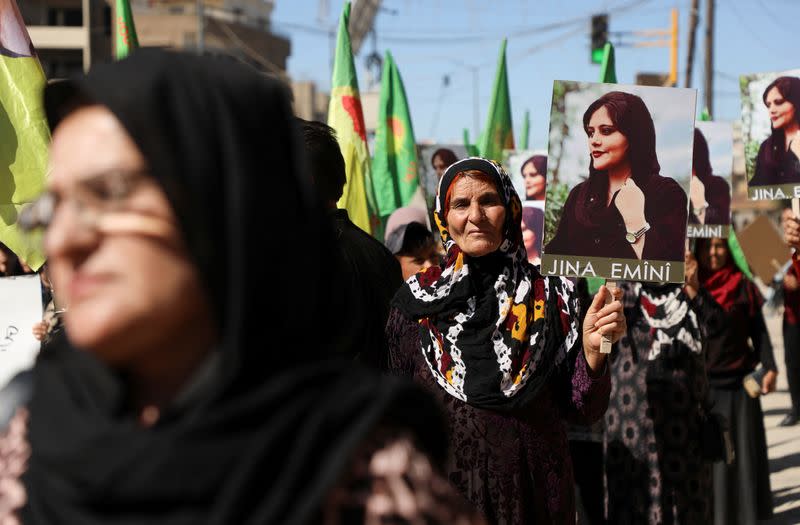 Women protest over the death of Mahsa Amini in Iran, in the Kurdish-controlled city of Qamishli