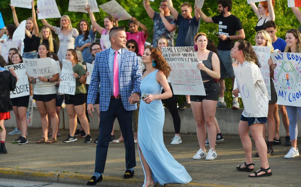 Former Vice President Mike Pence was the keynote speaker at the Carolina Pregnancy Center Gala. The former vice president spoke at the Spartanburg Memorial Auditorium on May 5, 2022. As the former vice president spoke a group of protesters gathered across the street from the the event.  A couple going to the event walks thorough and reacts to a crowd of protesters at the event.