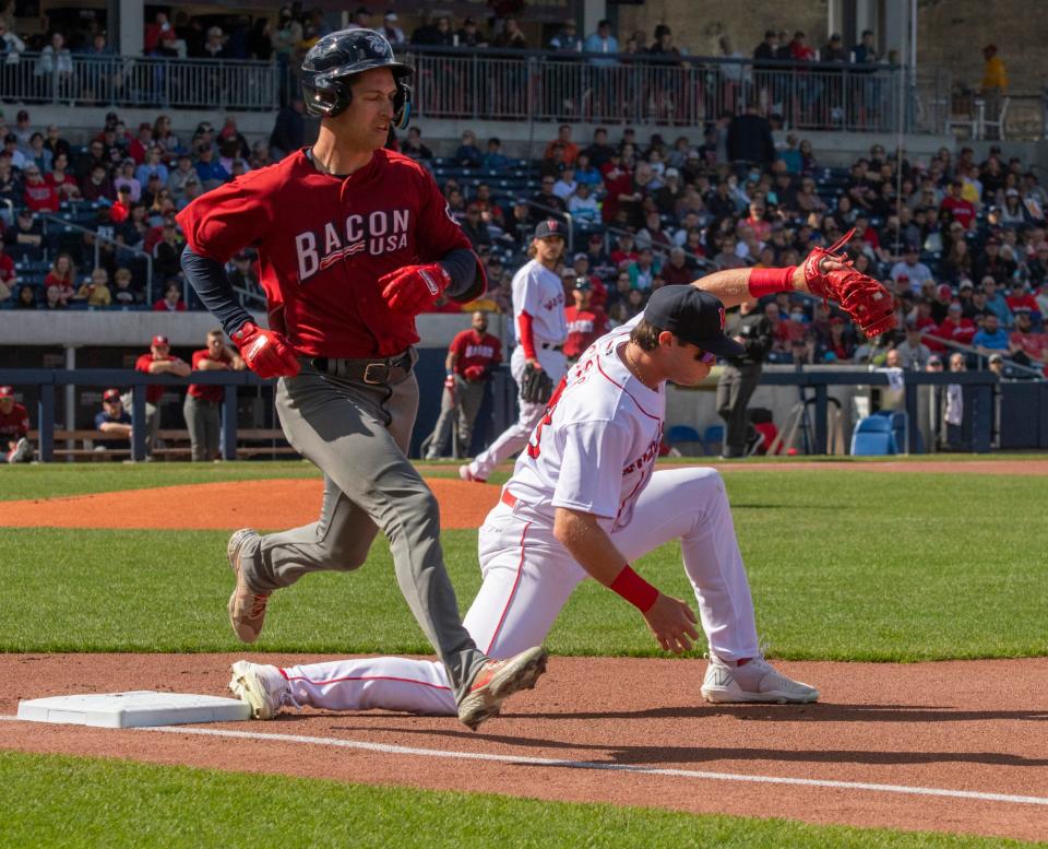 WORCESTER - Red Sox first baseman Triston Casas make the out on Lehigh Valley's Dalton Guthrie in the first inning at Polar Park Tuesday, April 12, 2022. 