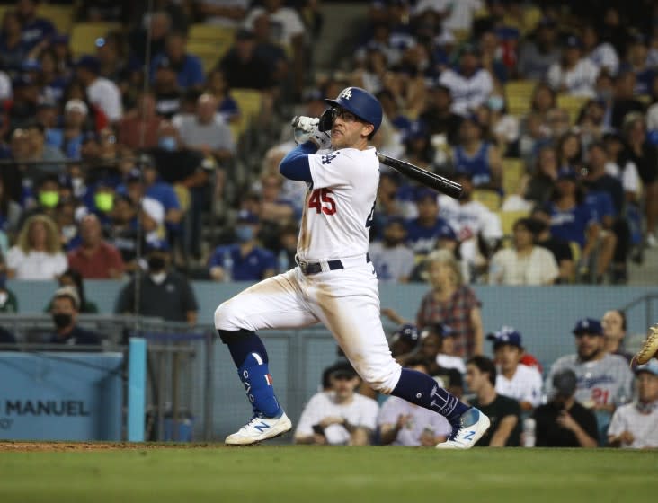 LOS ANGELES, CA - AUGUST 17, 2021: Los Angeles Dodgers first baseman Matt Beaty (45) hits a 2-run RBI double to give the Dodgers a 4-2 lead against the Pirates in the fifth inning at Dodger Stadium on August 17, 2021 in Los Angeles, California.(Gina Ferazzi / Los Angeles Times)