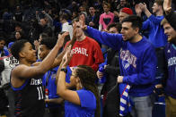 DePaul guard Charlie Moore (11) greets fans after an NCAA college basketball game against Butler Saturday, Jan. 18, 2020, in Chicago. DePaul won 79-66. (AP Photo/Matt Marton)