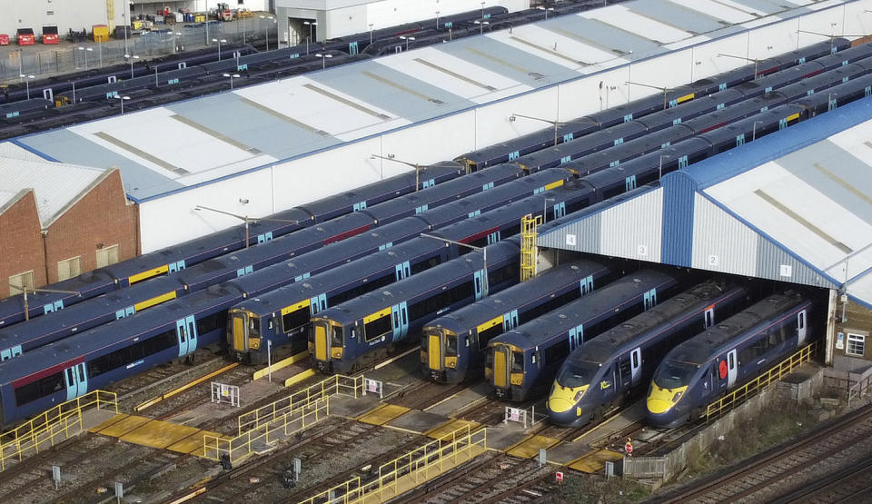 Southeastern trains are parked in sidings at Ramsgate station as rail workers from the Rail, Maritime and Transport and Aslef unions take strike action in a dispute over pay, in Ramsgate, England, Wednesday Feb. 1, 2023. Thousands of schools in the U.K. closed some or all of their classrooms, train services were paralyzed and delays were expected at airports Wednesday in what’s shaping up to be the biggest day of industrial action Britain has seen in more than a decade, as unions step up pressure on the government to demand better pay amid a cost-of-living crisis. (Gareth Fuller/PA via AP)