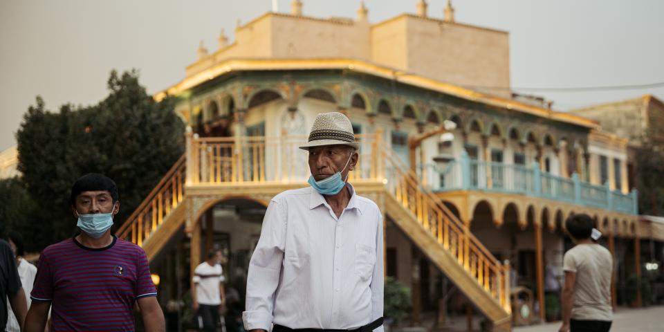 KASHGAR, CHINA - JUNE 30, 2020. An old Uyghur man walks in Kashgar old city on June 30, 2020 in Kashgar, China. (Photo by David Liu/Getty Images)
