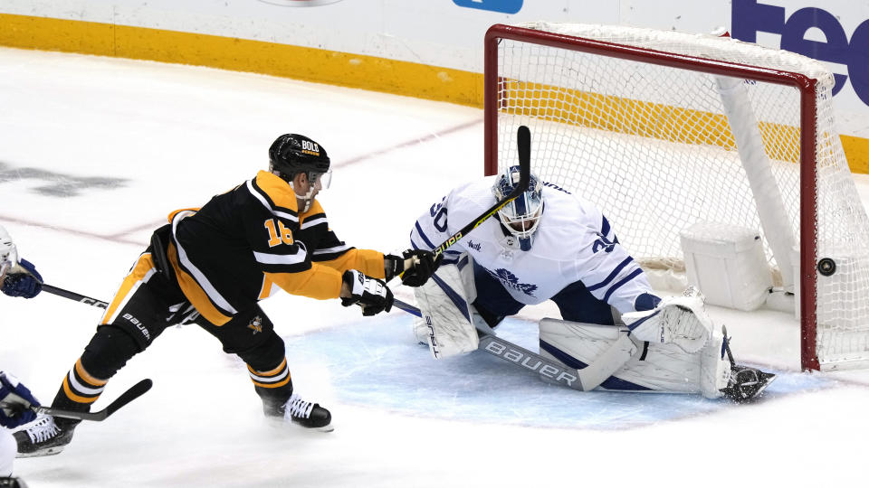 Pittsburgh Penguins' Jason Zucker (16) backhands a shot wide in front of Toronto Maple Leafs goaltender Matt Murray (30) during the first period of an NHL hockey game in Pittsburgh, Tuesday, Nov. 15, 2022. The Maple Leafs won 5-2. (AP Photo/Gene J. Puskar)