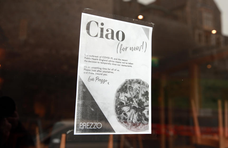 A closed sign in a Prezzo store as Queen Elizabeth II arrives at Windsor Castle, from Buckingham Palace in London to socially distance herself amid the coronavirus pandemic. Photo: Adam Davy/PA Images via Getty Images