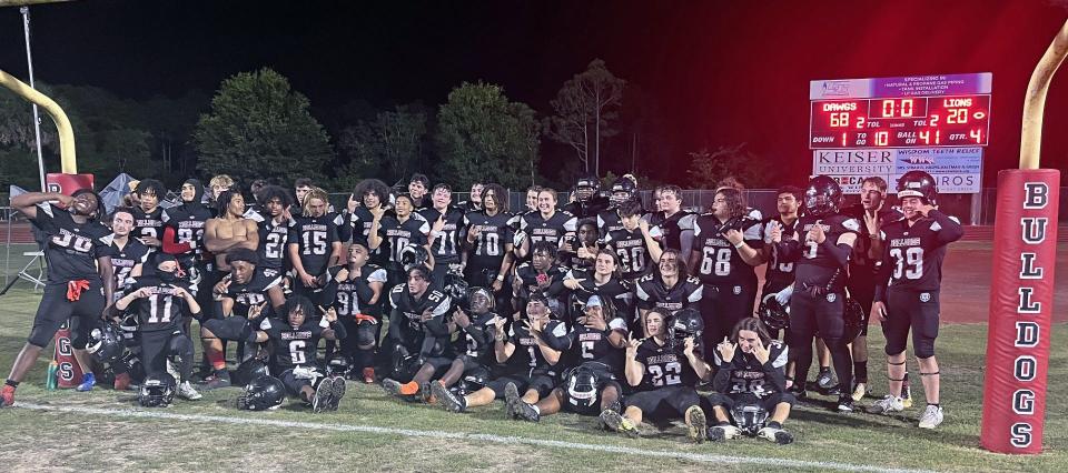 The South Fork High football team poses under the goal post after defeating Olympic Heights High, 68-20, in a spring football game Friday night at Joebud Staggs Stadium in Stuart.
