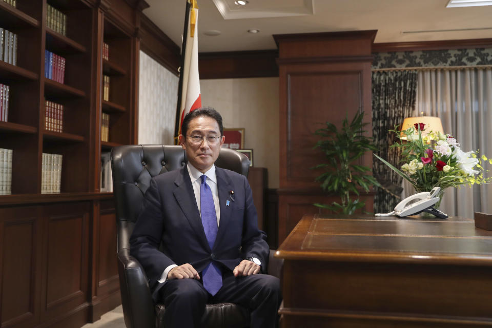 Japan’s former Foreign Minister Fumio Kishida poses for a portrait picture following his press conference at the headquarters of the Liberal Democratic Party after he was elected as party president in Tokyo Wednesday, Sept. 29, 2021. Kishida won the governing party leadership election on Wednesday and is set to become the next prime minister, facing the imminent task of addressing a pandemic-hit economy and ensuring a strong alliance with Washington to counter growing regional security risks. (Du Xiaoyi/Pool Photo via AP)