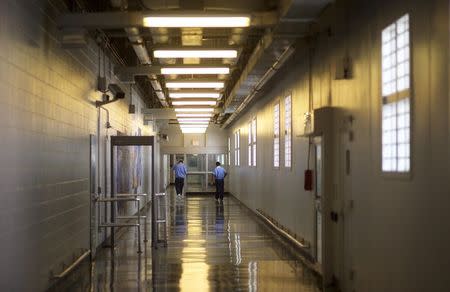 Inmates walk the hallways during a media tour of the Curran-Fromhold Correctional Facility in Philadelphia, Pennsylvania, August 7, 2015. REUTERS/Mark Makela