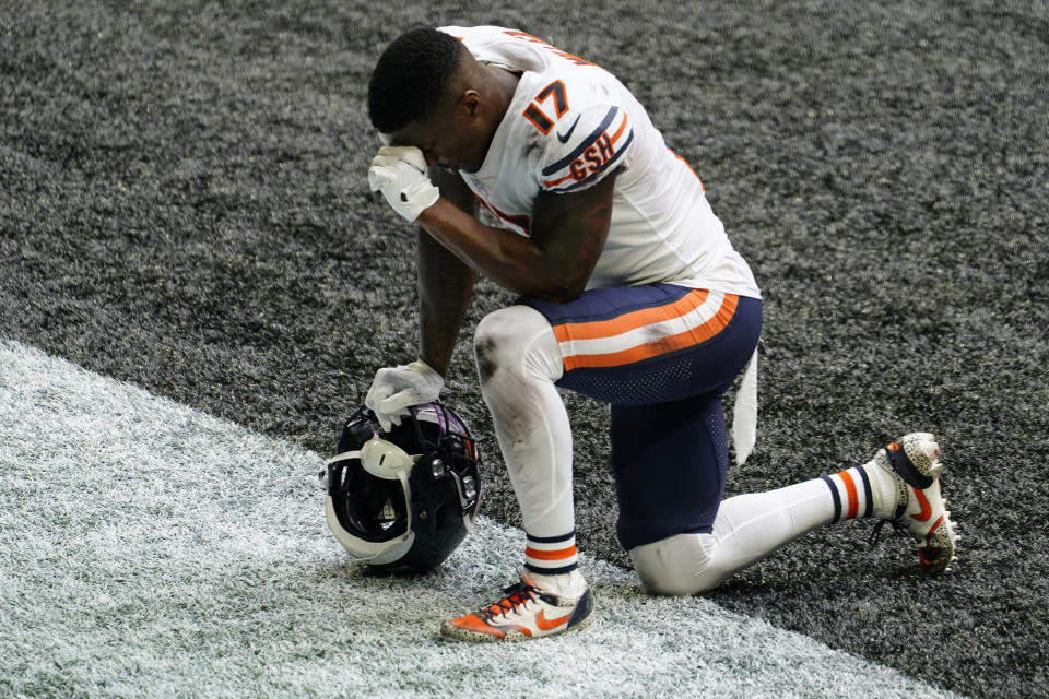 Chicago Bears wide receiver Anthony Miller (17) prays after an NFL football game against the Atlanta Falcons, Sunday, Sept. 27, 2020, in Atlanta. The entire Chicago Bears team had the initials of former player Gayle Sayers on their jerseys. (AP Photo/Brynn Anderson