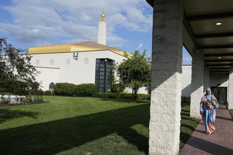 A Mauritanian leave the Islamic Center after a prayer serivce, Friday, July 21, 2023, in Cincinnati. A new surge in migration was made possible by the discovery earlier this year of a new route through Nicaragua, where relaxed entry requirements allow Mauritanians and a handful of other foreign nationals to purchase a low-cost visa without proof of onward travel. (AP Photo/Darron Cummings)