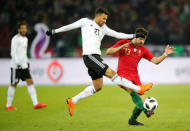 Soccer Football - International Friendly - Portugal vs Egypt - Letzigrund, Zurich, Switzerland - March 23, 2018 Egypt’s Trezeguet in action with Portugal's Ruben Neves REUTERS/Arnd Wiegmann