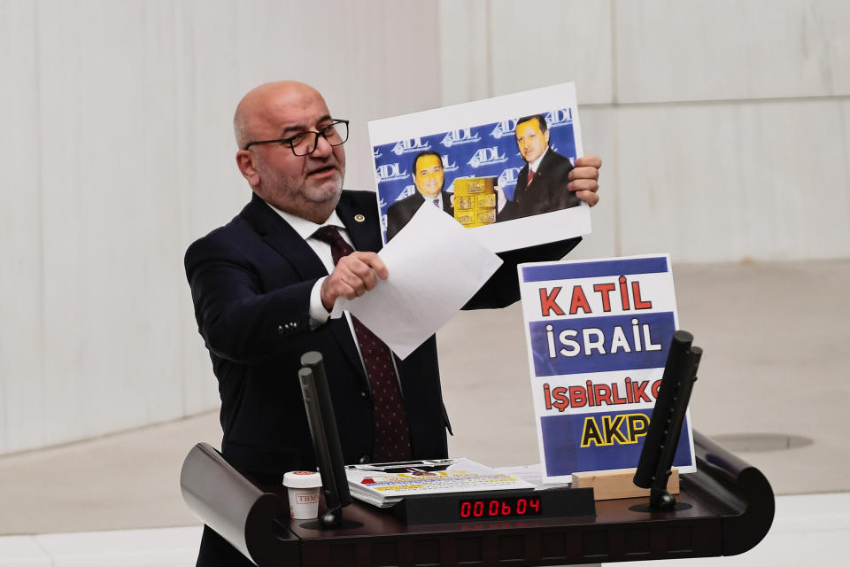 Hasan Bitmez, 53, a Turkish lawmaker from the Islamist Saadet Partisi, or Felicity Party, speaks at the main chamber of the Turkish parliament in Ankara, Thursday, Dec. 14, 2023. Bitmez died in a hospital on Thursday, days after he suffered a heart attack, and collapsed in parliament just after delivering a speech critical of Israel and of the ruling party's relationship with the country. (Selahattin Sonmez/Dia Images via AP)