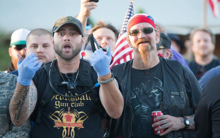 Anti-Islam protesters gesture at supporters of an Islamic Community Centre during a demonstration in Phoenix, Arizona on May 29, 2015