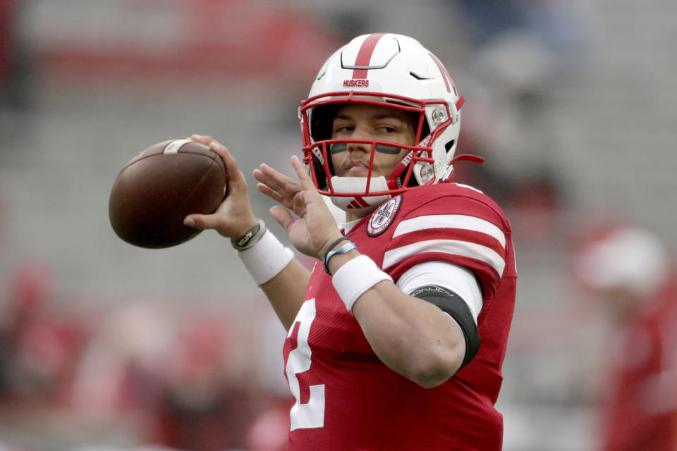 Nebraska quarterback Adrian Martinez warms up before an NCAA college football game against Iowa in Lincoln, Neb., Friday, Nov. 29, 2019. Martinez turned back a challenge from Luke McCaffrey to win the starting quarterback's job for Nebraska's opener at No. 5 Ohio State, coach Scott Frost announced Monday, Oct. 19, 2020. (AP Photo/Nati Harnik, File)