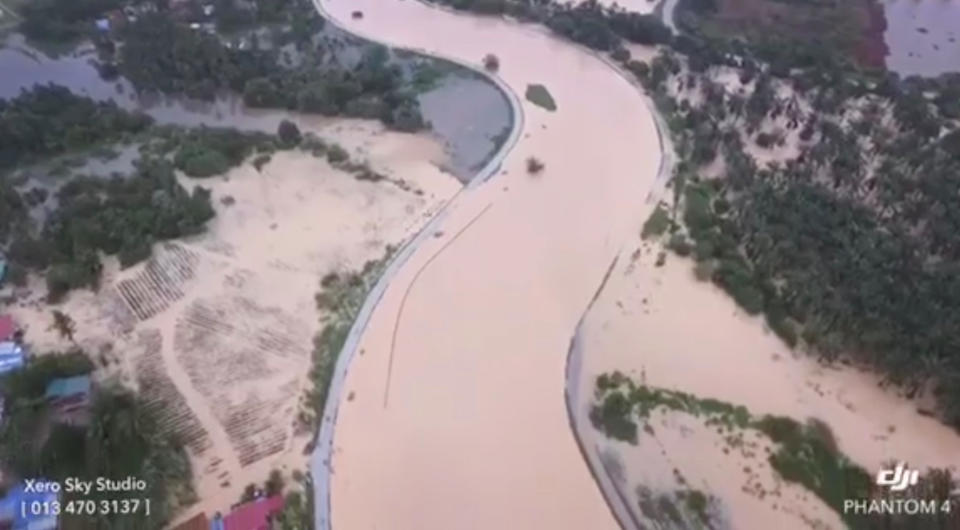 An aerial view shows the banks of a river overflowed after floodwater rose for more than 24 hours of incessant rain, in Kubang Semang, Bukit Mertajam, Penang