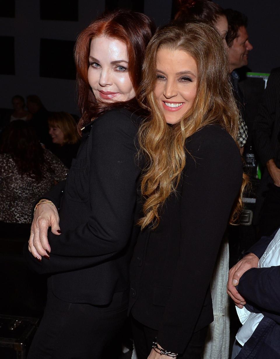 Priscilla Presley celebrates backstage with her daughter Lisa Marie Presley after Lisa Marie's performance at 3rd & Lindsley during the 14th Annual Americana Music Festival & Conference