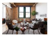 <p>A brick wall pairs well with mixed rug patterns in a living room by <a href="https://deringhall.com/interior-designers/jen-talbot-design" rel="nofollow noopener" target="_blank" data-ylk="slk:Jean Talbot Design;elm:context_link;itc:0;sec:content-canvas" class="link ">Jean Talbot Design</a>.</p>