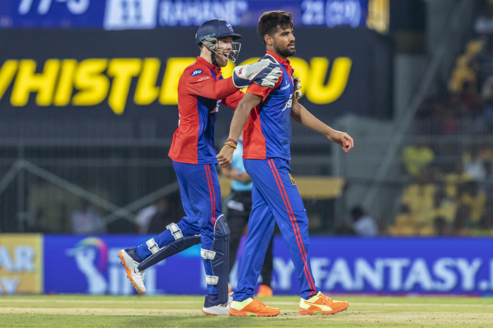 Delhi Capitals' Phil Salt, left, congratulates teammate Lalit Yadav after the later took the wicket of Chennai Super Kings' Ajinkya Rahane during the Indian Premier League cricket match between Delhi Capitals and Chennai Super Kings in Chennai, India, Wednesday, May 10, 2023. (AP Photo /R. Parthibhan)