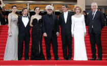 Director Pedro Almodovar (4th L) poses on the red carpet with cast members (L-R) Blanca Suarez, Jan Cornet, Elena Anaya, Antonio Banderas, Marisa Paredes and fashion designer Jean Paul Gaultier for the screening of the film "La Piel Que Habito", in competition at the 64th Cannes Film Festival, May 19, 2011. REUTERS/Jean-Paul Pelissier (FRANCE - Tags: ENTERTAINMENT)