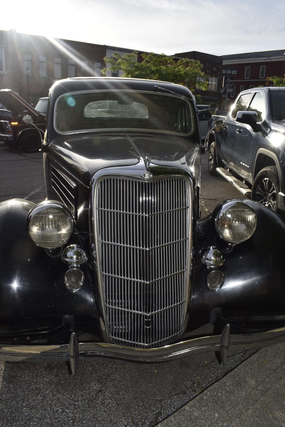 The setting sun shines on a 1935 Ford in downtown Martinsville.