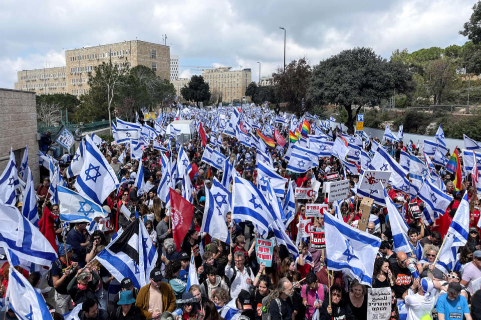 <div class="inline-image__caption"><p>Israelis protest near Israel's Supreme Court during a demonstration after Prime Minister Benjamin Netanyahu dismissed the defense minister in Jerusalem, March 27, 2023.</p></div> <div class="inline-image__credit">Ilan Rosenberg/Reuters</div>