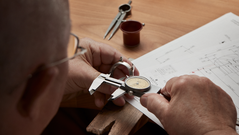 A watchmaker works on the case of the Louis Vuitton x Akrivia LVRR-01 Chronographe à Sonnerie