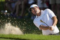 Scottie Scheffler hits from a bunker on the 17th hole during the second round of the Tour Championship golf tournament, Friday, Aug. 25, 2023, in Atlanta. (AP Photo/Mike Stewart)
