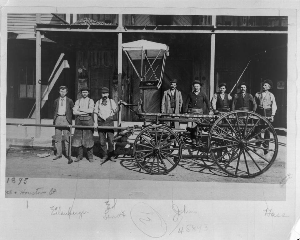 A group of men standing with a Texas Brewing Co. cart in 1895, at the corner of Eighth and Houston streets in Fort Worth.