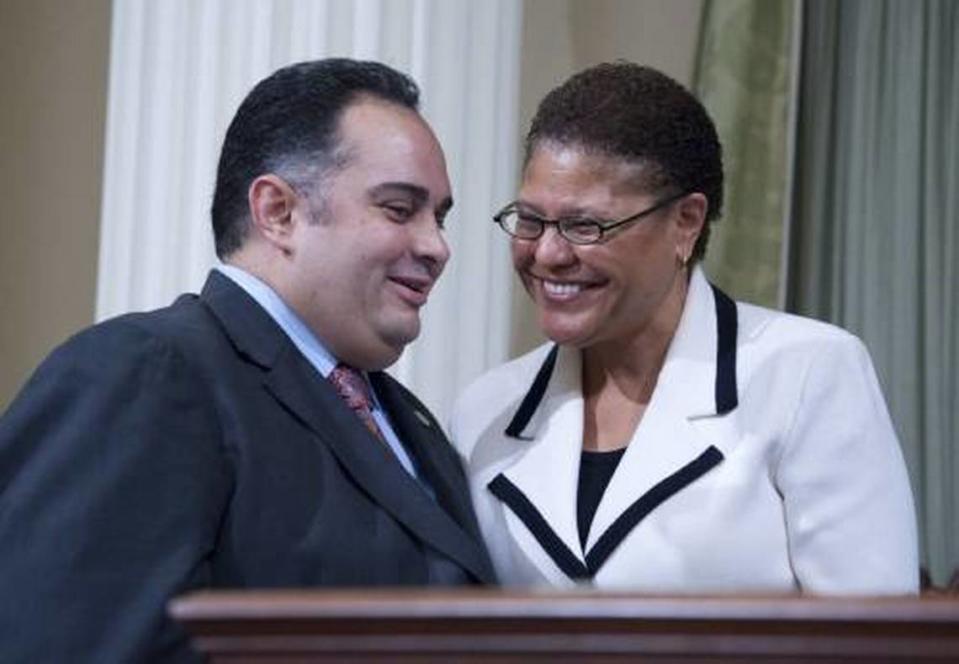 Speaker Karen Bass, D-Los Angeles, right, greets Assemblyman John A. Perez , D-Los Angeles before he was sworn in as speaker on Monday, March 1, 2010 at the Capitol in Sacramento, Calif..