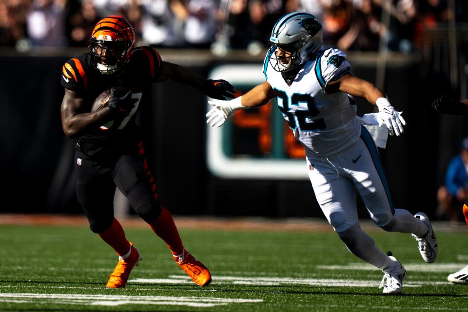 Cincinnati Bengals linebacker Germaine Pratt (57) returns an interception as Carolina Panthers tight end Tommy Tremble (82) goes to tackle him in the second quarter during a Week 9 NFL game, Sunday, Nov. 6, 2022, at Paycor Stadium in Cincinnati. Mandatory Credit: Albert Cesare-The Enquirer