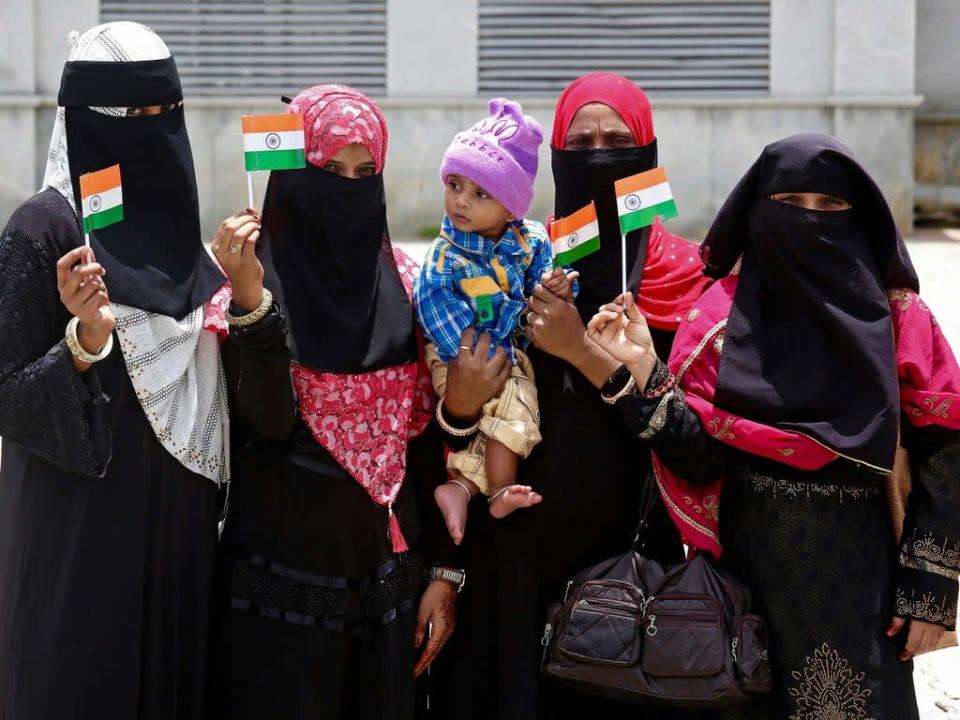 Indian Muslim women pose with Indian flags as part of the Independence Day celebrations in Bengaluru city on 15 August 2019  (EPA)