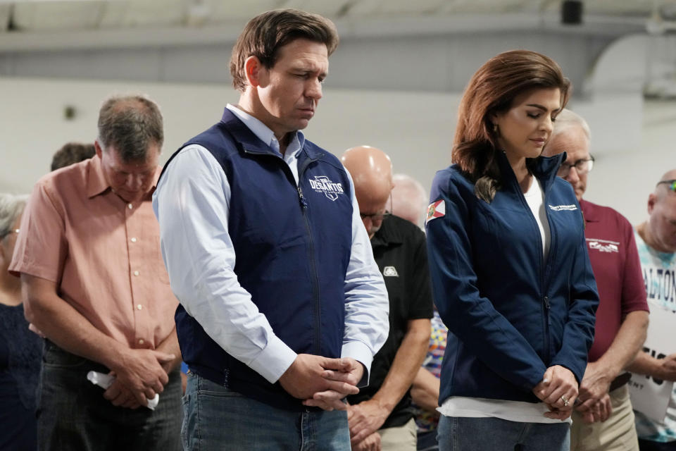 FILE - Republican presidential candidate Florida Gov. Ron DeSantis and his wife, Casey, bow their heads during a prayer at a campaign event, Wednesday, May 31, 2023, in Cedar Rapids, Iowa. (AP Photo/Charlie Neibergall, File)