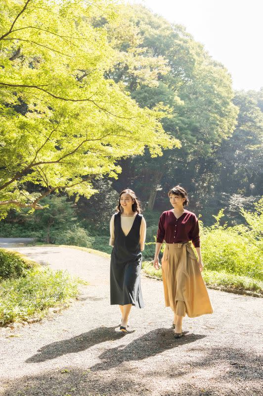 Japan's Princess Mako, the daughter of Crown Prince Akishino and Crown Princess Kiko, strolls with her younger sister Princess Kako at the garden of their Akasaka imperial property residence in Tokyo