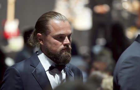 U.S actor Leonardo DiCaprio walks during an auction at the amfAR's Cinema Against AIDS 2015 event during the 68th Cannes Film Festival in Antibes, near Cannes, southern France, May 21, 2015. REUTERS/ Regis Duvignau - RTX1E1EZ