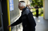 A local resident injured in a Russian strike walks in a hospital in Pokrovsk, eastern Ukraine, Wednesday, May 25, 2022. Two rockets struck the eastern Ukrainian town of Pokrovsk, in the Donetsk region early Wednesday morning, causing at least four injuries. (AP Photo/Francisco Seco)