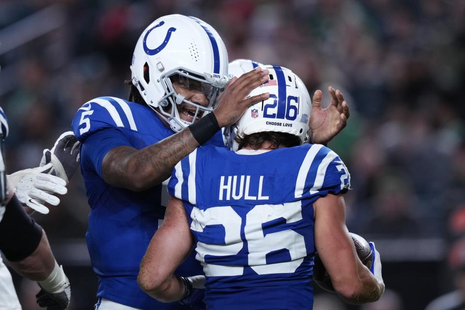 Indianapolis Colts running back Evan Hull (26) celebrates a touchdown with teammate Anthony Richardson during the first half of an NFL preseason football game Thursday, Aug. 24, 2023, in Philadelphia. (AP Photo/Matt Slocum)