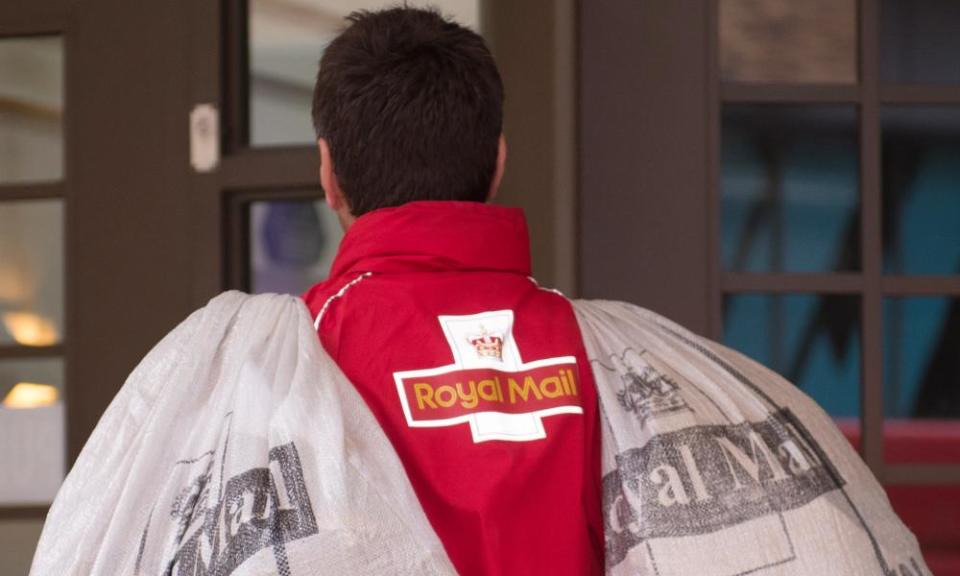 Royal Mail postman carrying bags of mail