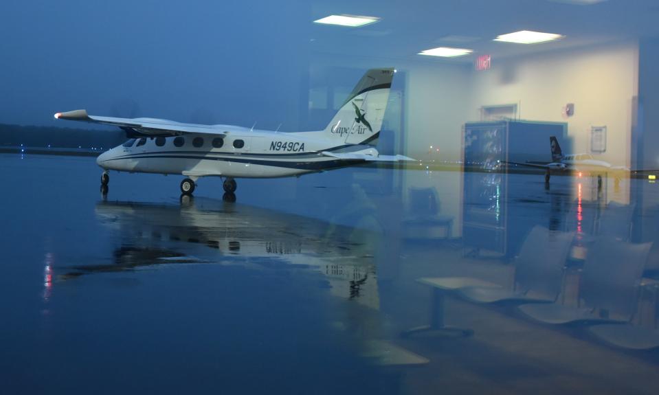 In a 2020 photo, Cape Air Flight 7551 to Nantucket taxis to the runway as another plane arrives on the tarmac at Cape Cod Gateway Airport in Hyannis.