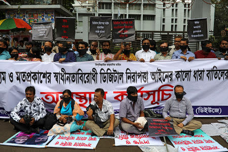 Journalists hold banners and placards as they protest against the newly passed Digital Security Act in front of the Press Club in Dhaka, Bangladesh, October 11, 2018. REUTERS/Mohammad Ponir Hossain