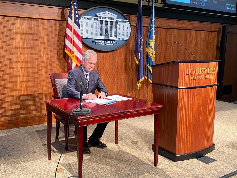 Louisville Metro Mayor Greg Fischer signs into law in 2020 an ordinance establishing a civilian review board and inspector general office to oversee police actions.