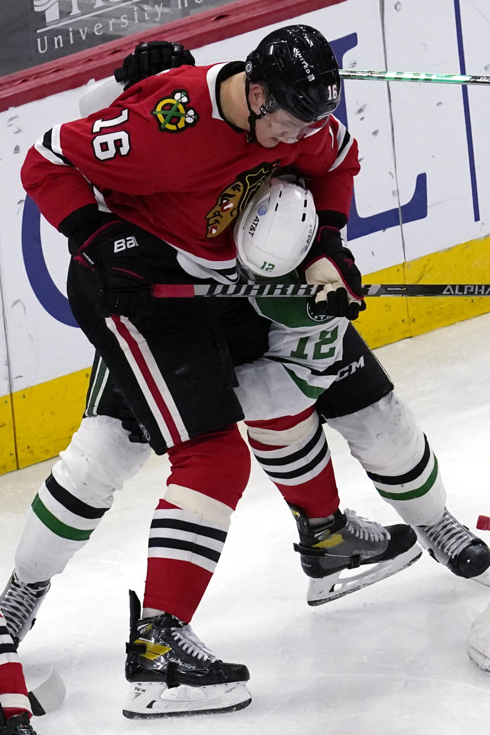 Chicago Blackhawks defenseman Nikita Zadorov, left, works for the puck against Dallas Stars center Radek Faksa during the second period of an NHL hockey game in Chicago, Sunday, May 9, 2021. (AP Photo/Nam Y. Huh)