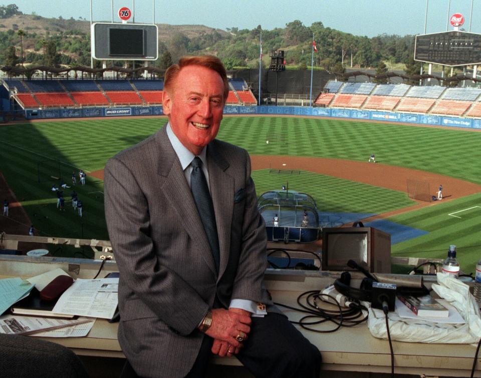 Dodger announcer Vin Scully sits in broadcasting booth at Dodger Stadium in an undated photo.