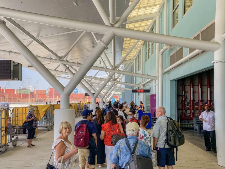 People waiting in line at the cruise terminal.