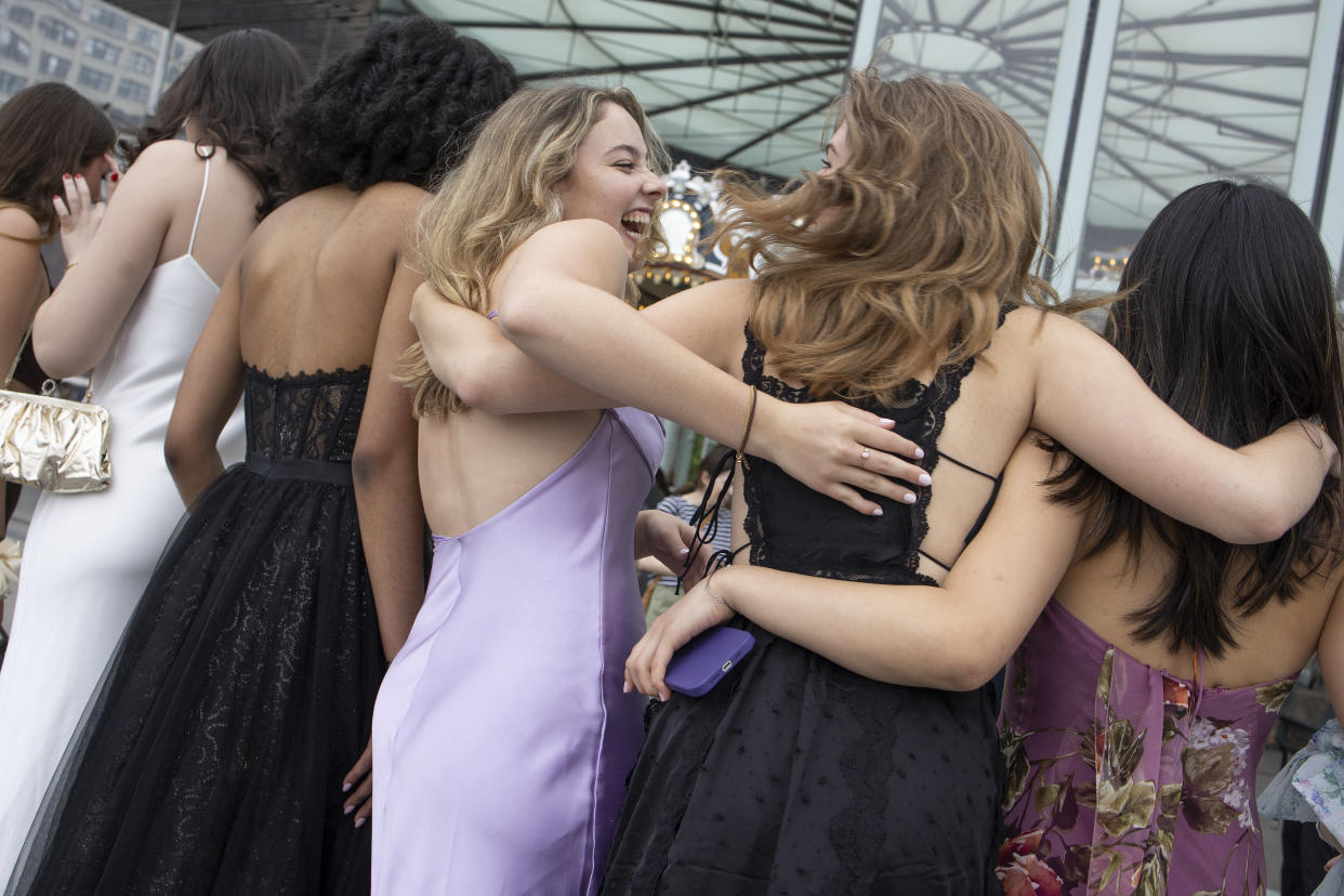 A group of high school students pose together ahead of their prom on May 20, 2022, in Brooklyn, New York.