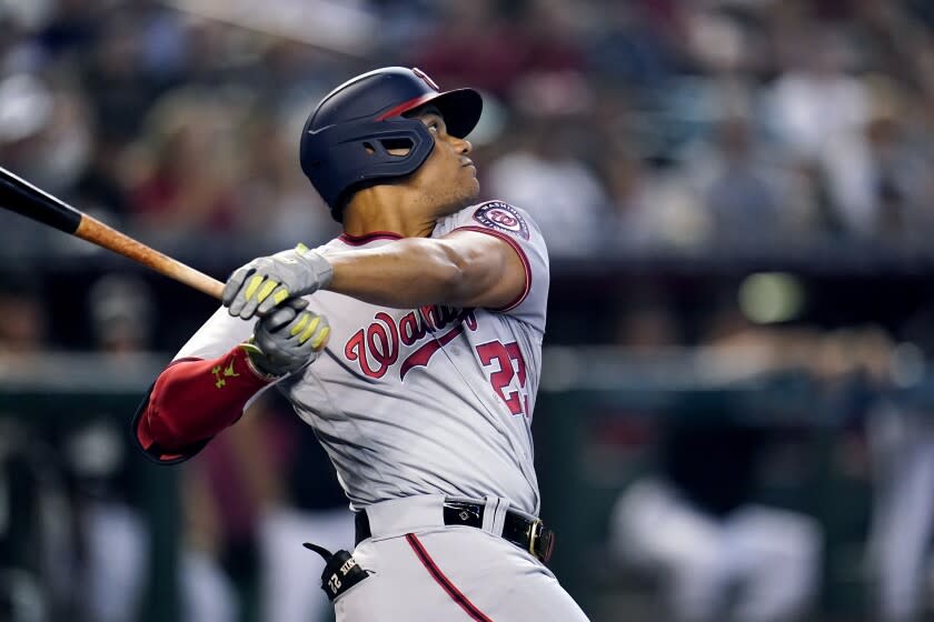 Washington Nationals' Juan Soto fouls off a pitch against the Arizona Diamondbacks.