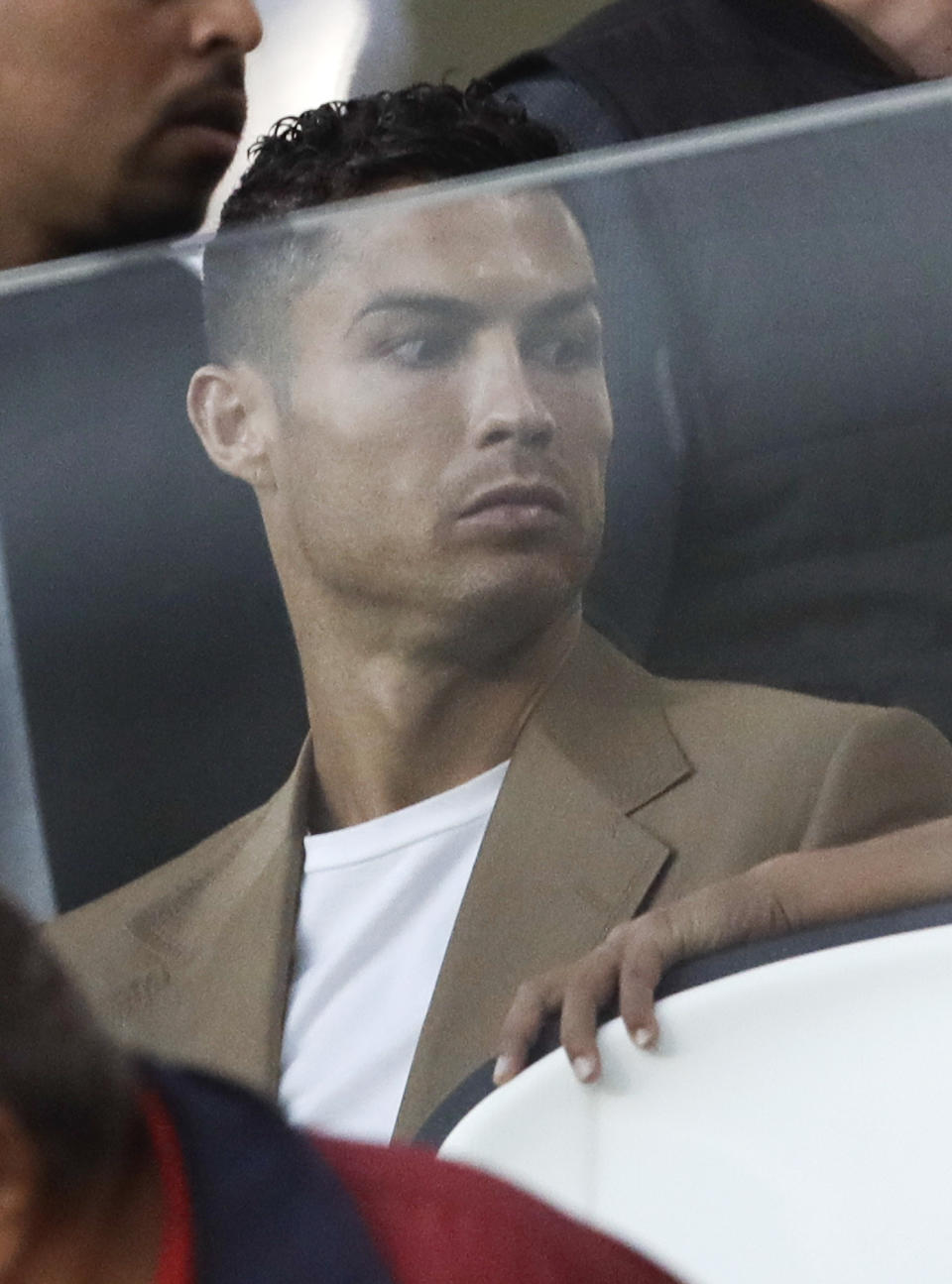 FILE - In this Tuesday, Oct. 2, 2018 file photo, Juventus forward Cristiano Ronaldo sits in the stands during a Champions League, group H soccer match between Juventus and Young Boys, at the Allianz stadium in Turin, Italy. Lawyers for a Nevada woman who has accused Cristiano Ronaldo of raping her say a psychiatrist determined she suffers post-traumatic stress and depression because of the alleged 2009 attack in Las Vegas. Kathryn Mayorga's attorney, Leslie Stovall, told reporters Wednesday that the psychiatrist's medical opinion is that Mayorga's psychological injuries made her "incompetent" to legally reach a non-disclosure settlement with Ronaldo's representatives in 2010. (AP Photo/Luca Bruno, File )