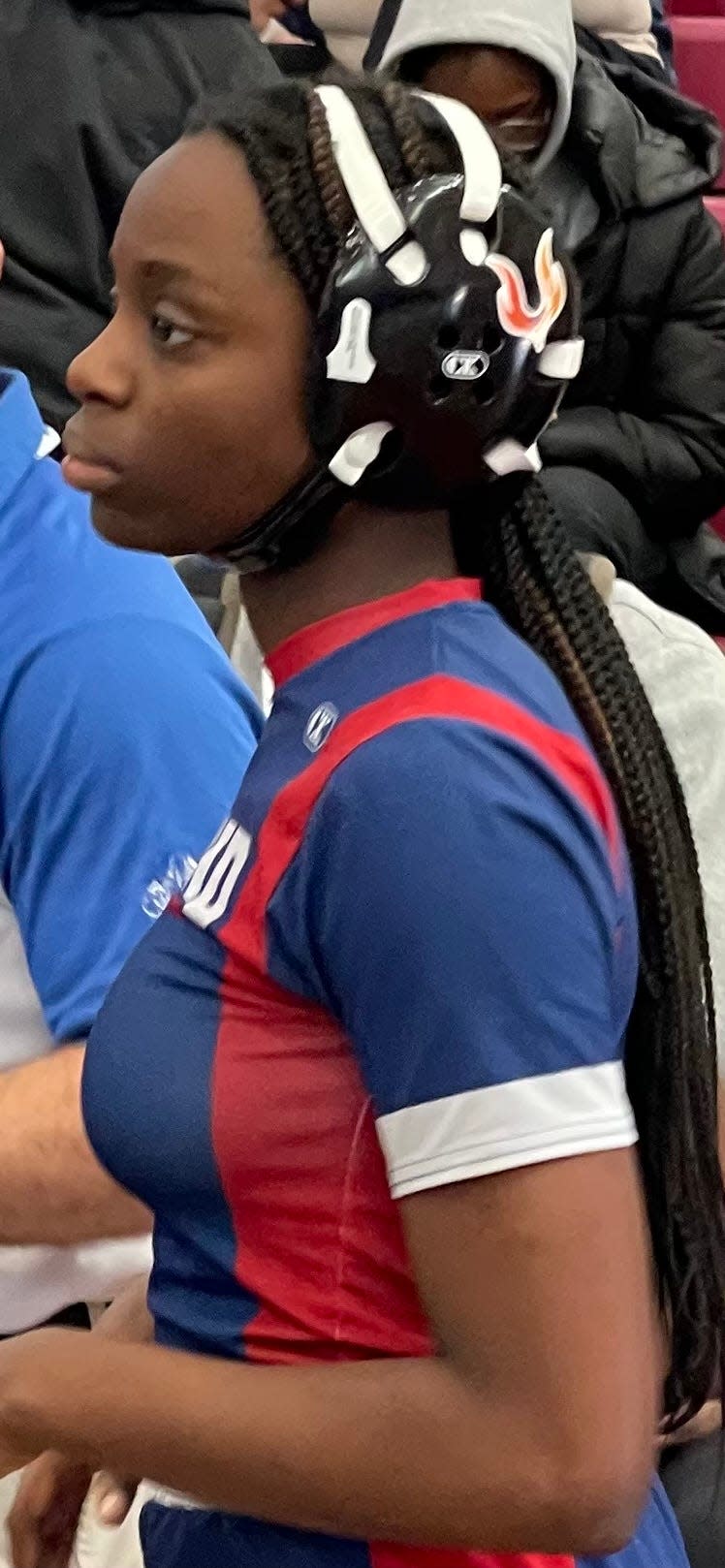 Ashland's Angie Nommi gets in the zone prior to her fifth-place match, which she won, at the All-States wrestling championships in Salem on Saturday, Feb. 24