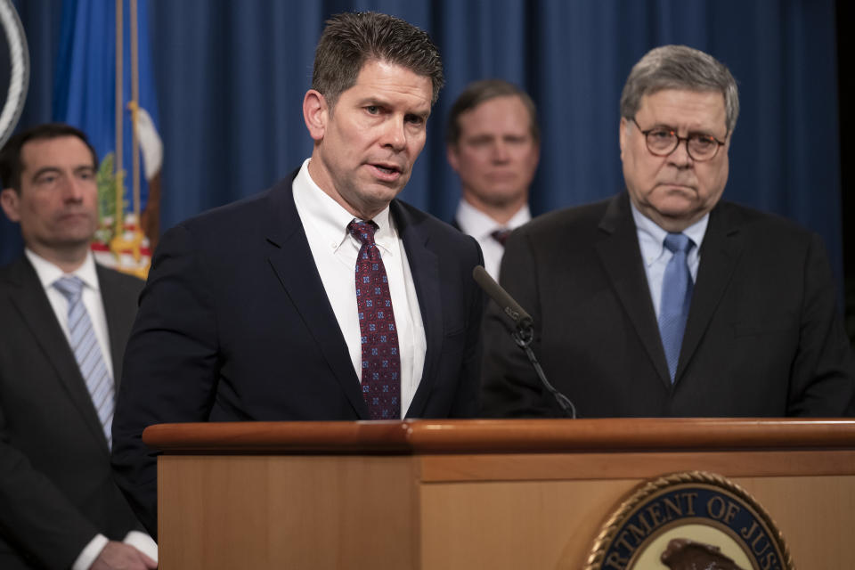 FBI Deputy Director David Bowdich, left, and Attorney General William Barr, right, speak to reporters at the Justice Department in Washington, Monday, Jan. 13, 2020, to announce results of an investigation of the shootings at the Pensacola Naval Air Station in Florida. On Dec. 6, 2019, 21-year-old Saudi Air Force officer, 2nd Lt. Mohammed Alshamrani, opened fire at the naval base in Pensacola, killing three U.S. sailors and injuring eight other people. (AP Photo/J. Scott Applewhite)